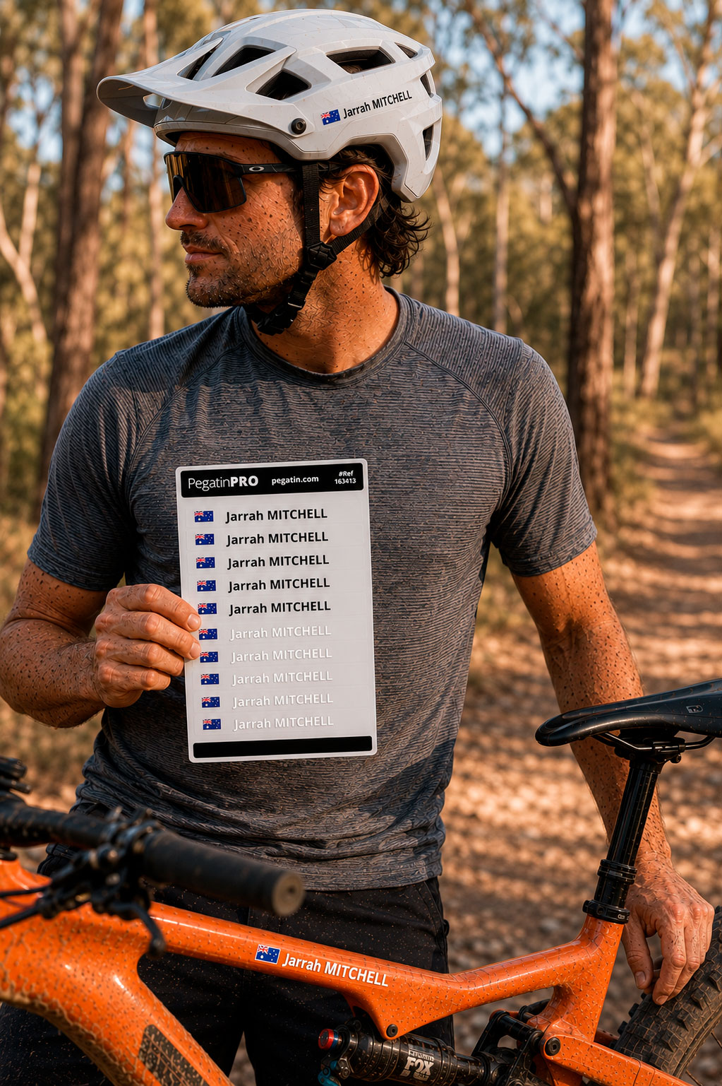 Mountain biker holding a Pegatin personalised sticker pack