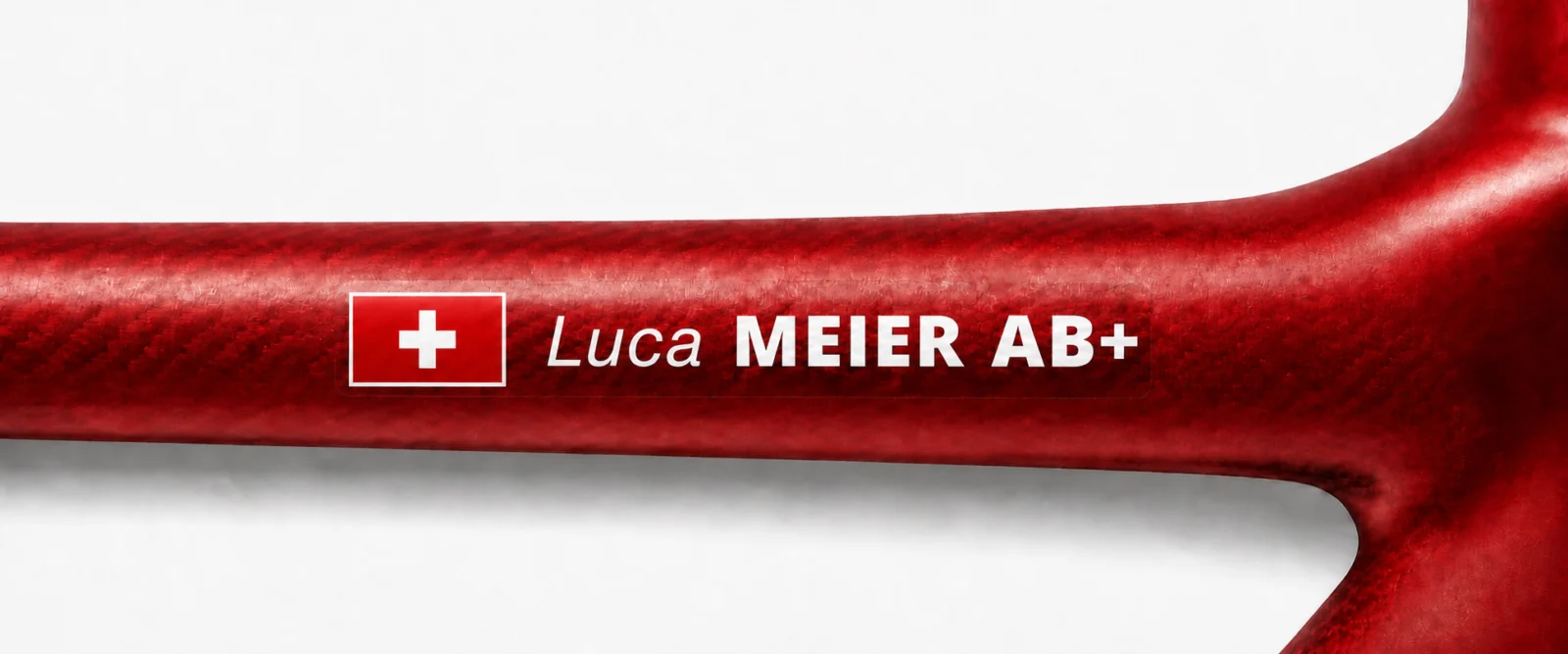 Tube rouge de vélo avec autocollant Luca MEIER AB+ et drapeau suisse