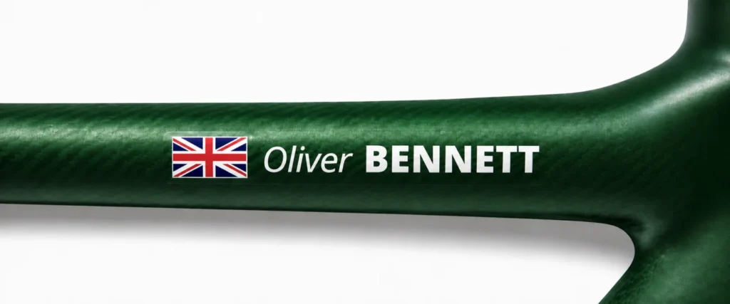 UK name sticker on a green bike frame