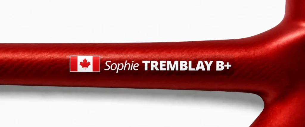 Canadian name and blood type sticker on a red bike frame