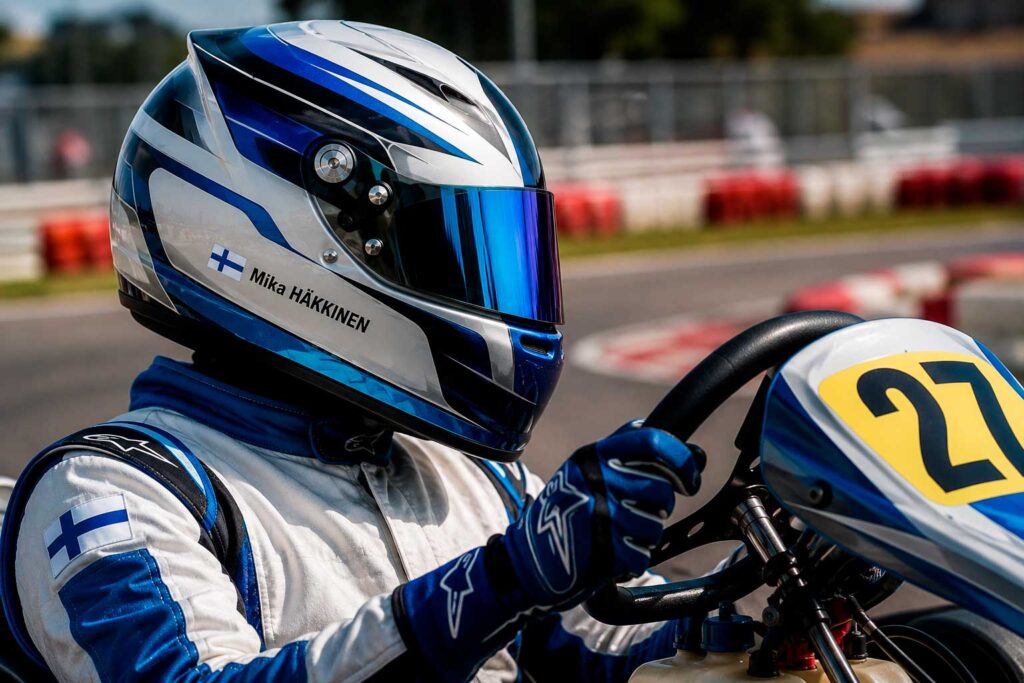 Personalised name and flag sticker on a karting helmet