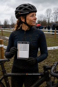 Gravel cyclist holding a Pegatin personalised sticker pack