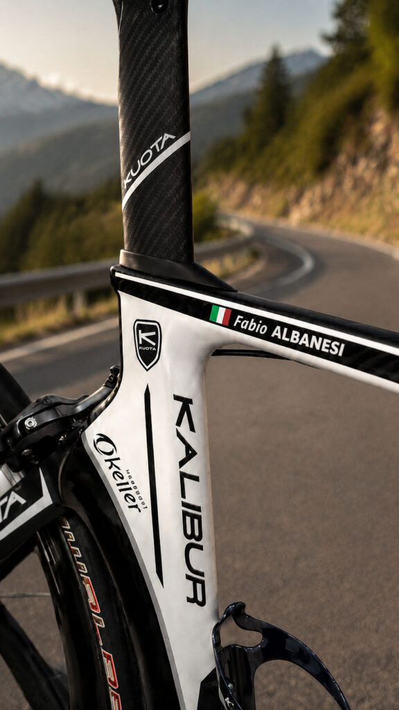 Personalised name and flag sticker on a white road bike frame
