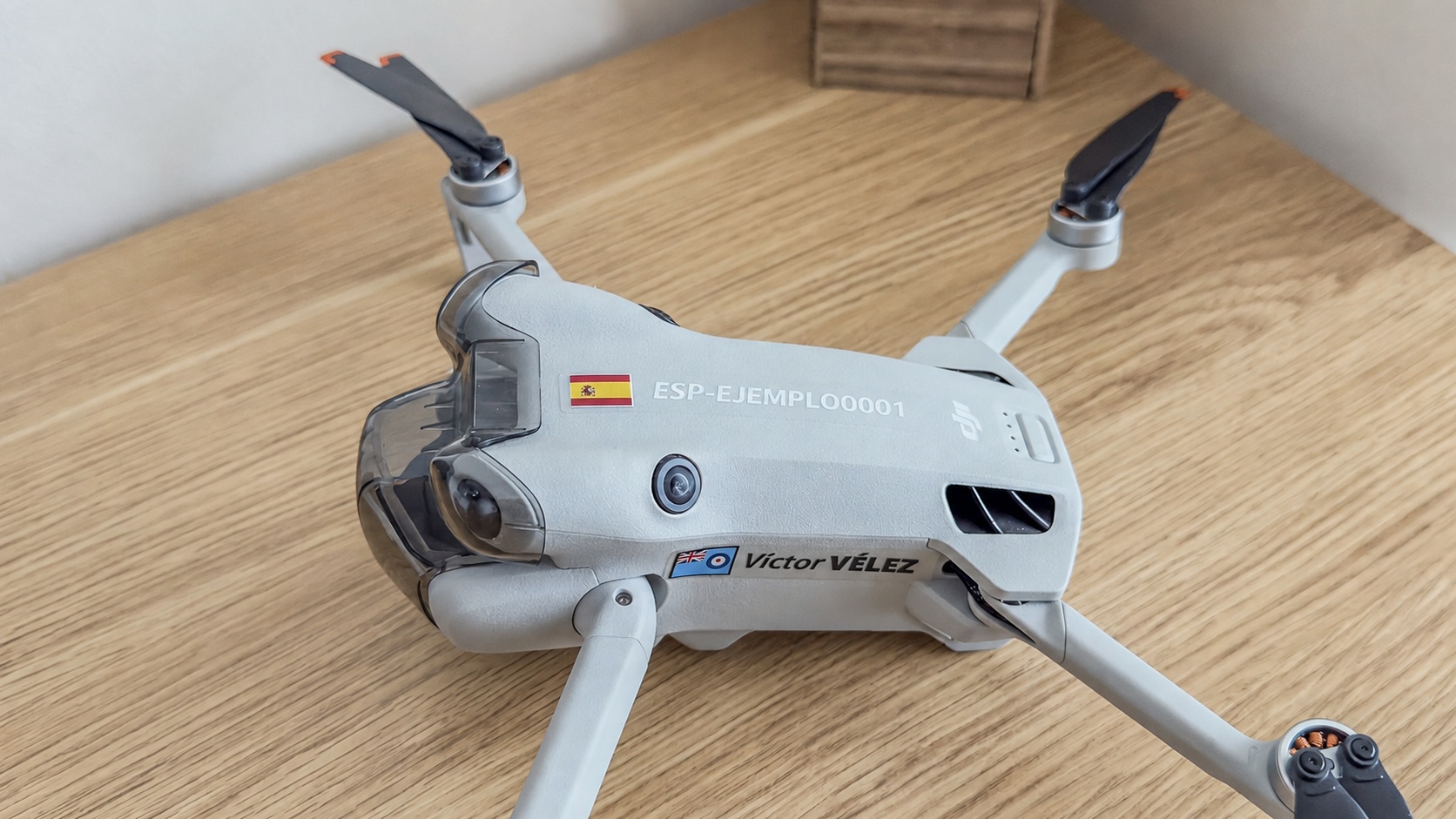 UK drone Operator ID sticker positioned on the main body of a compact drone