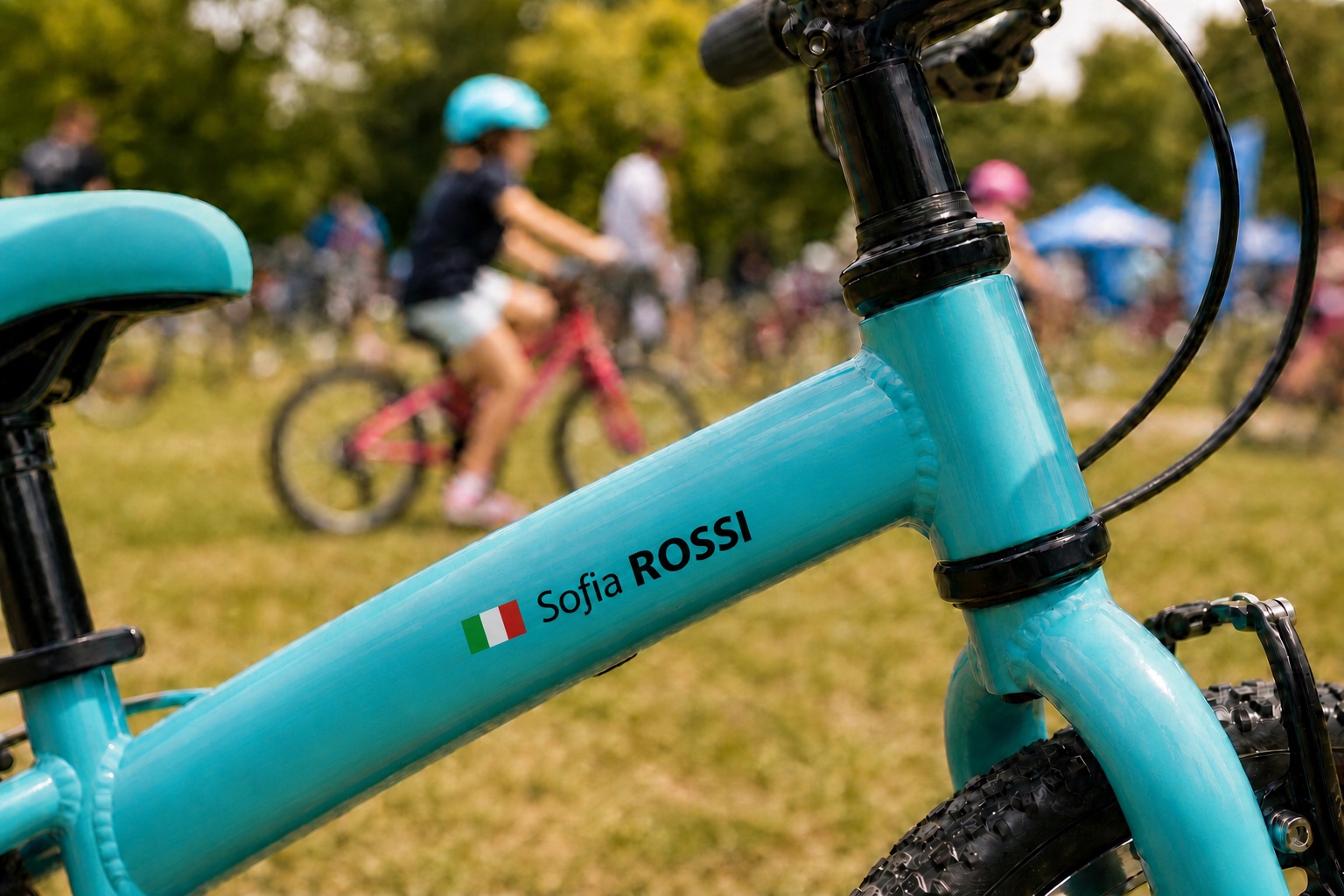 Kids bike name stickers with Italian flag and Sofia ROSSI on a turquoise children's bicycle