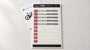 Pegatin PRO name-and-flag sticker sheet with its printed card