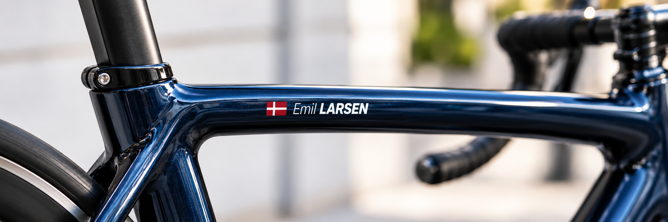 Name and Danish flag on a blue road bike